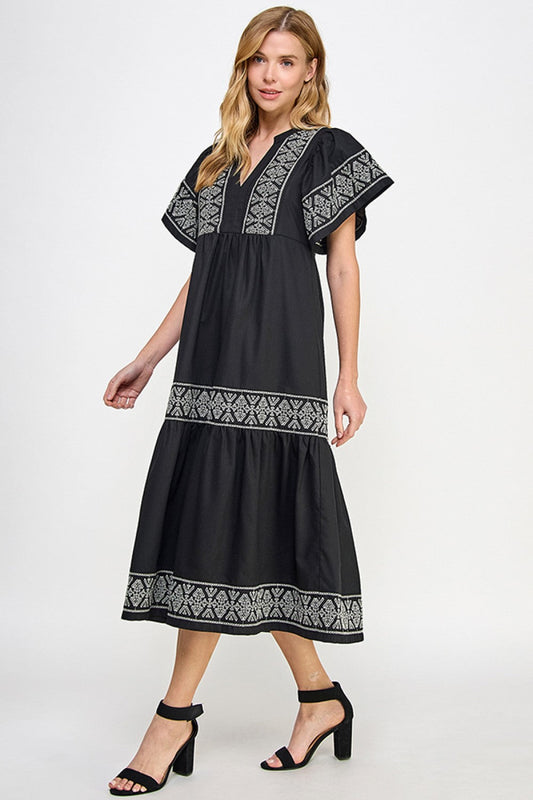 Elegante zwarte linnenjurk met borduursel